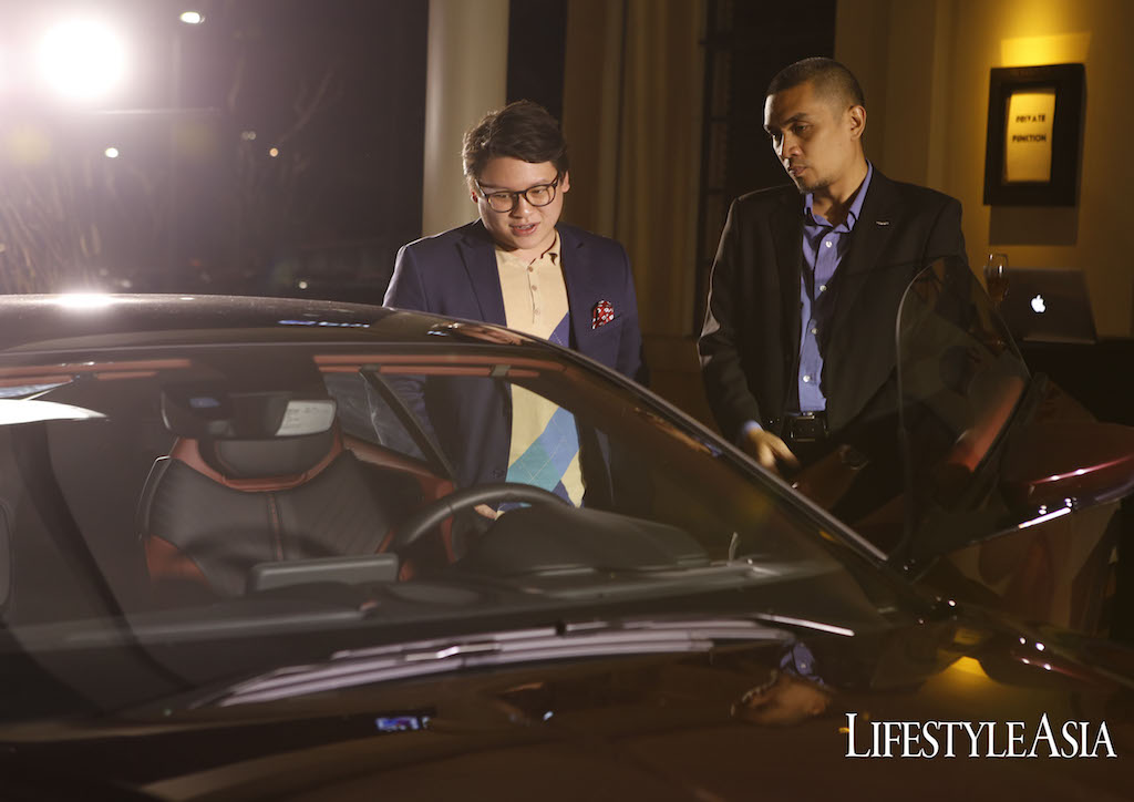 Lifestyle Asia's Chino R. Hernandez learning about the Aston Martin