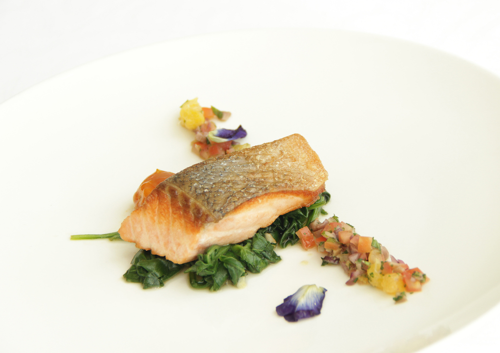 Pan-seared salmon, wilted spinach, tomato confit, virgin citrus sauce
