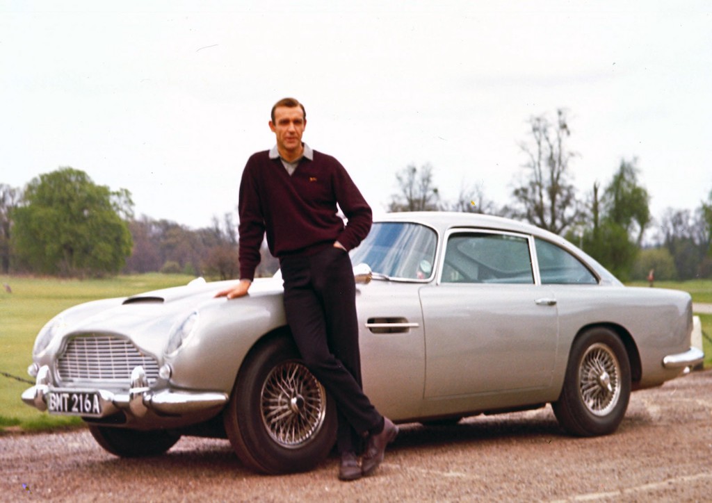 Sean Connery as James Bond with his silver Aston Martin DB5 in Goldfinger (1964)