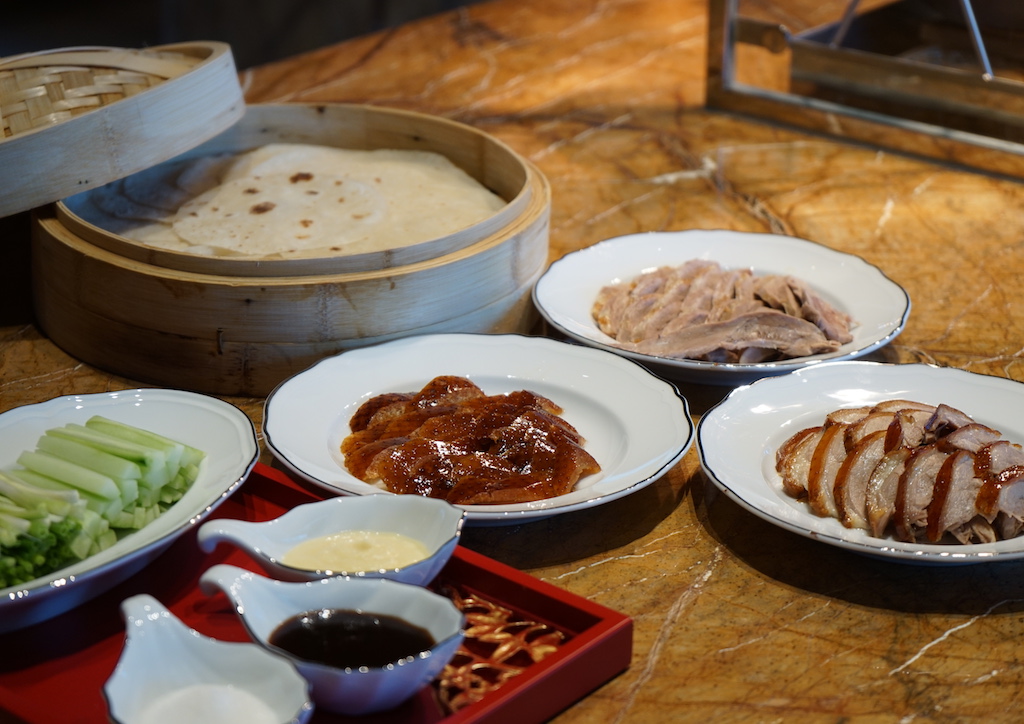 Tableside service will carve the duck that is served with traditional paper-thin Chinese pancakes, strips of cucumber, hopisin sauce and sugar