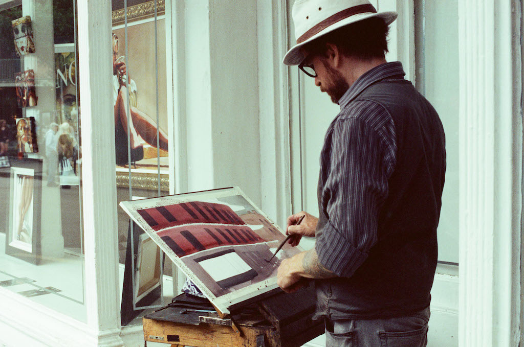 An artist puts the finishing touches to his work along the streets of the Vieux Carré