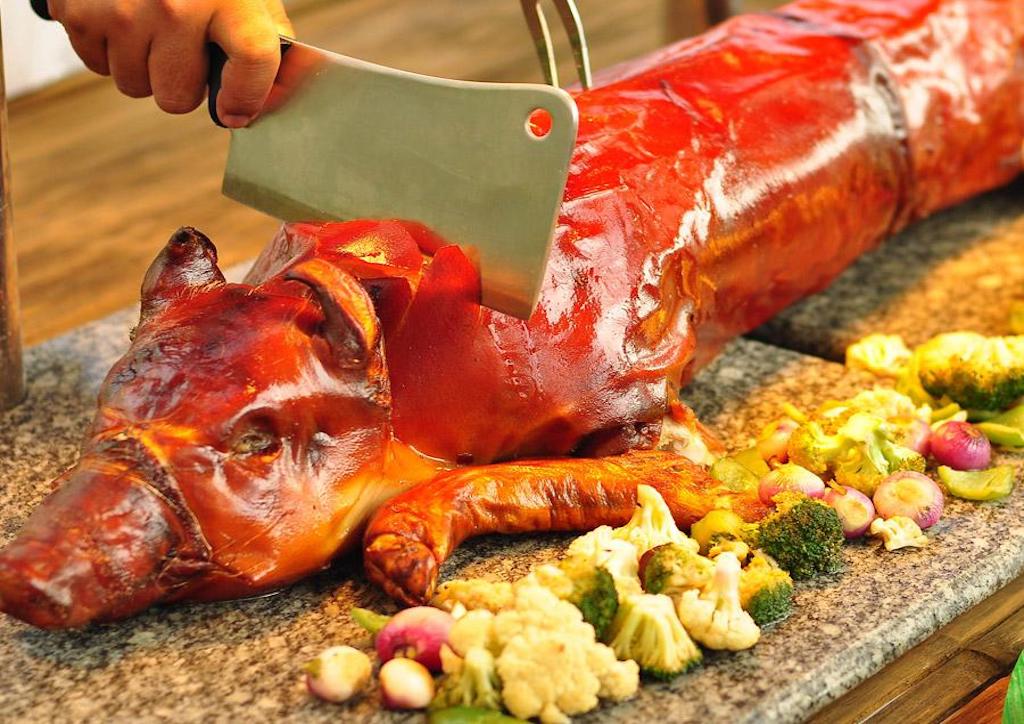 Crispy roast whole pork - A traditional dish served during a Scandinavian Holiday feast. Whole pork roasted until its skin is crispy.