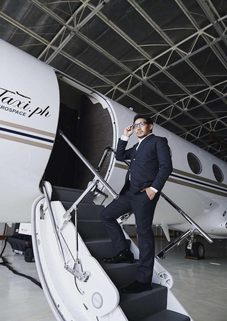 Paj Rodriguez outside a Gulfstream Business Jet (Photography by Hub Pacheco) 