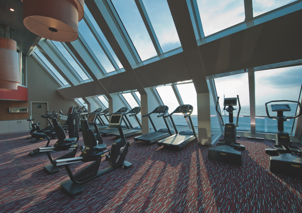 The gym onboard features beautiful views of the ocean 