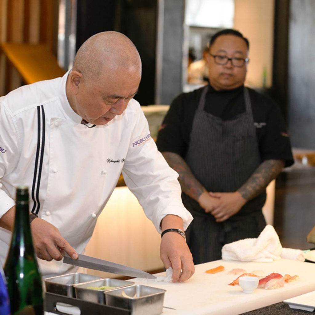 Chef Nobu presenting his culinary skills